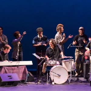 The cast of Purple State Purple Haze grooves as the curtain closes